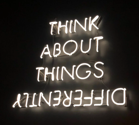 Neon Sign "Think about things differently"