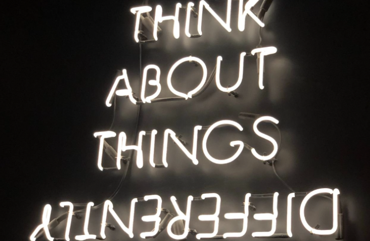 Neon sign "Think about things differently"