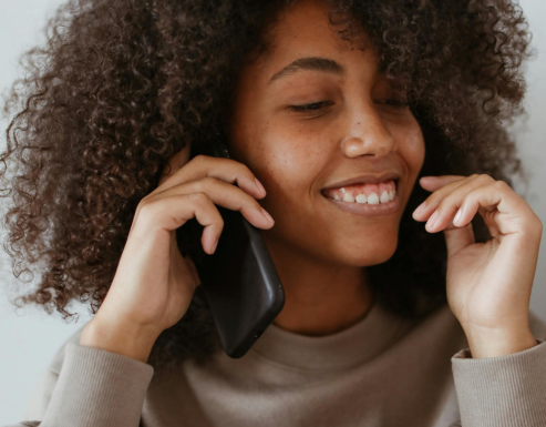 Woman talking on the phone and smiling