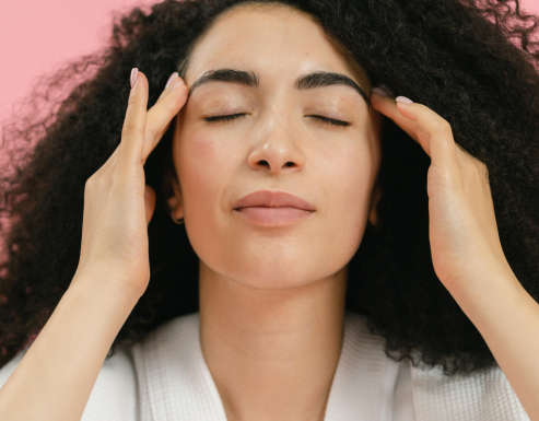 Woman massaging her head