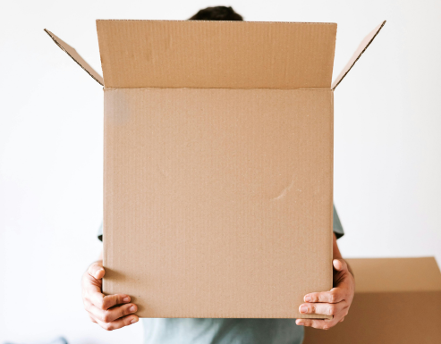 person grabbing a box